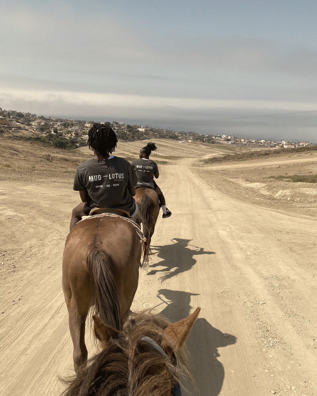 Riders on a coastal trail